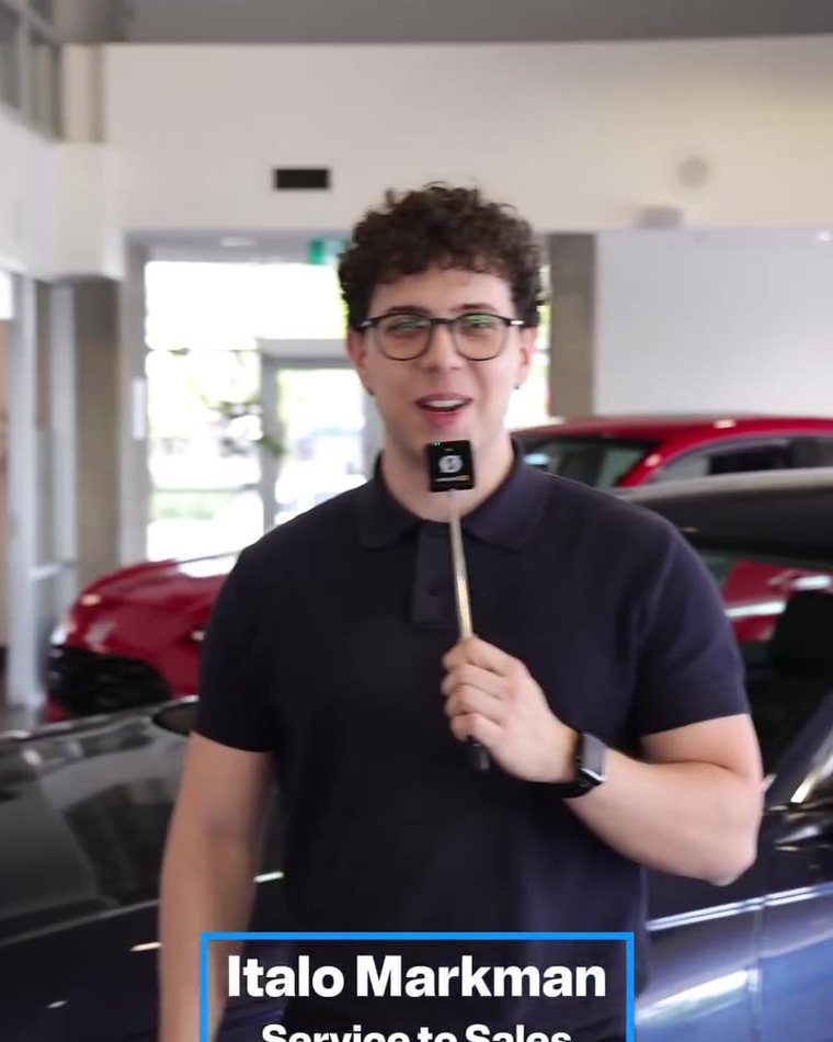 Italo presenting on camera in the Honda showroom